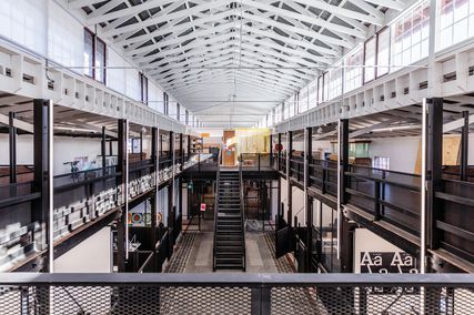 Studios are contained within the two-storey stables wing. First-floor studios on new floors are broken up with floor-to-roof voids that allow views of the original structure.