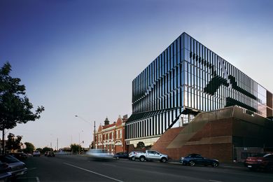 At the BRICC, a glazed, five-storey facility adjoins a red brick building on the corner of Sturt and Drummond Streets.