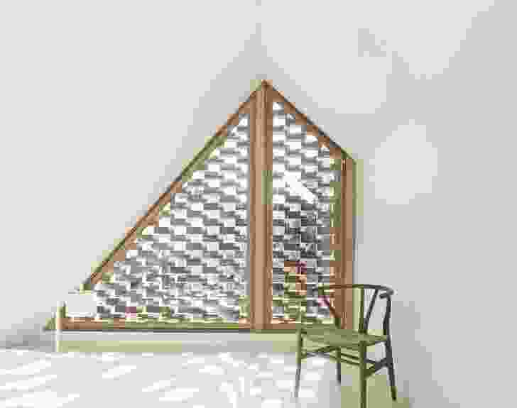 The lattice brickwork filters dappled sunlight into the mezzanine bedroom.