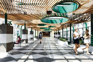 The upper level of the bridge has been converted into green space, with snaking beds of plants. Fixed binoculars give visitors the opportunity to look out onto busy Lonsdale Street.