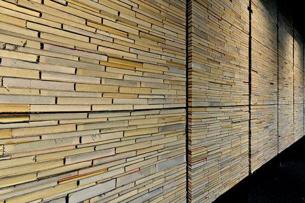 Discarded books live anew as a wall in Deakin Waurn Ponds Library by Six Degrees Architects.