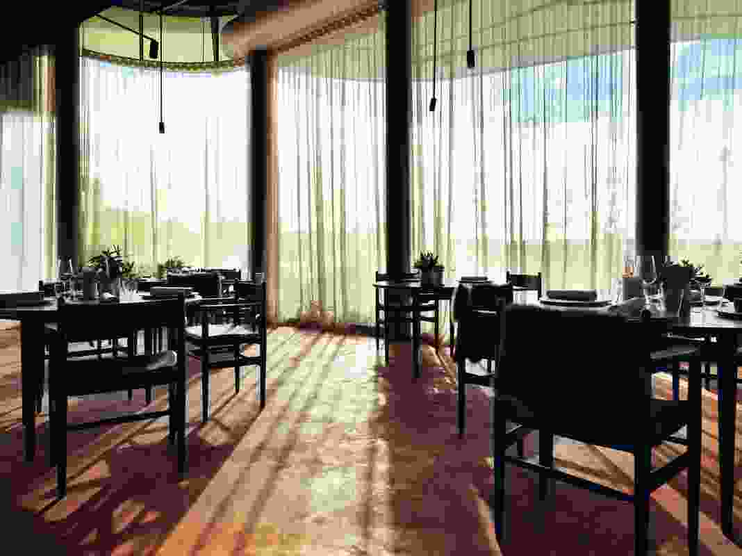 The restaurant showcased Danish design, including Carl Hansen furniture and Kvadrat fabric curtains .