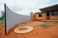 A curved windbreak was used at Canteen Creek for both privacy and shelter. Its position could be customized to suit house orientation and householder requirements.