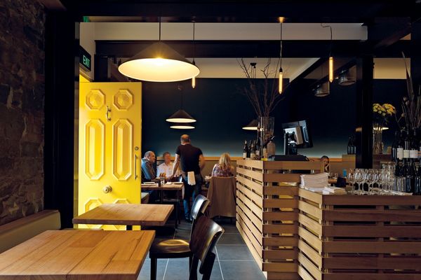 Timber and brass dominate the main restaurant and bar.