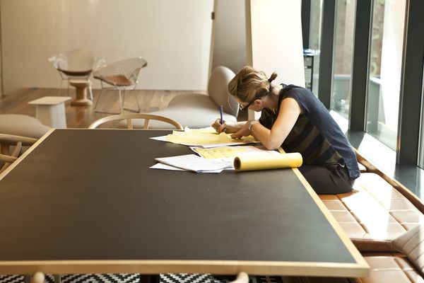 A female architect at work in BVN studio.