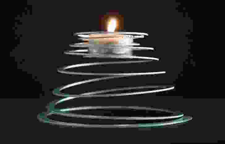 Spiralite supports a tealight on an extended aluminium coil.