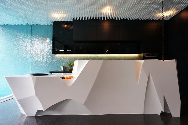 The Wynnstay House island bench made of Corian is designed to look like an iceberg, and fits in with the water theme in the building's interiors.