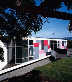The
front facade, with the Hobart
skyline beyond. The colours
and pattern of the facade are
influenced by Froebel blocks.