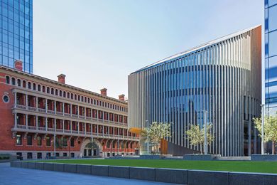 The City of Perth Library, with its distinctive circular form and angled top, maintains open views to the Titles Building.