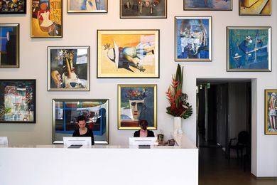 Reception is in simple white, with the artworks taking centre stage.