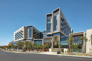 The hospital’s facade is modulated by tall, narrow forms that take cues from terrace housing.