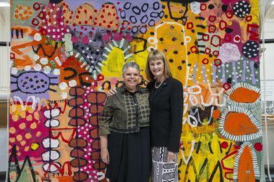 ATW Director Antonia Syme AM (right) and Deborah Cheetham AO with ‘The Royal Harvest’, 2021, by Naomi Hobson.