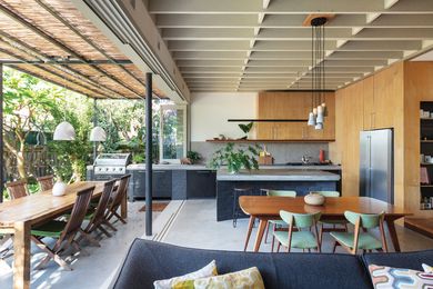 The kitchen and living area extend into the garden, making the most of the northern light.