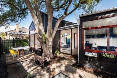 The blackened exterior form is a reworking of the cottage and shed vernacular that dominates the area.