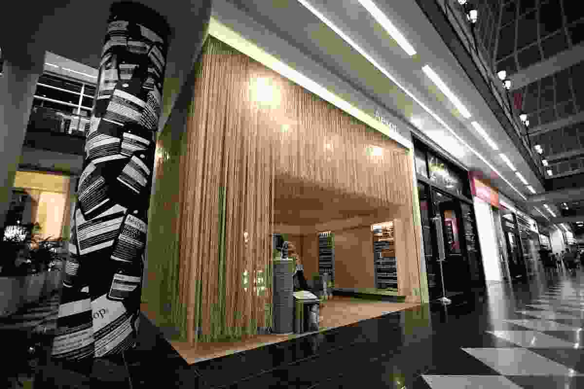 The design of the store makes a statement in the difficult corner space of the shopping centre.