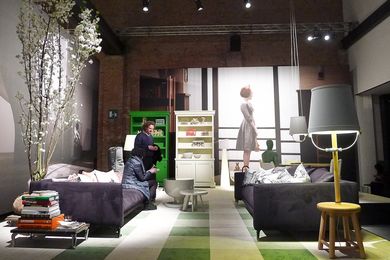 One of the Moooi displays at 2013 Salone del Mobile in Milan, featuring over-scaled photographs as the backdrop for domestic furniture settings.