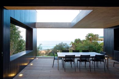 The Whale Beach House has black timber stained walls.