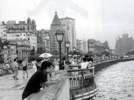 On the Bund, with the old part of the city in the background.