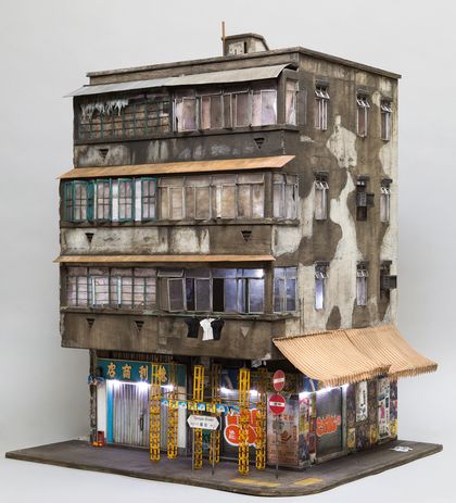 23 Temple Street is based on a building in Kowloon, Hong Kong, and is made from cardboard, MDF, plastic card, spray paint and wire.