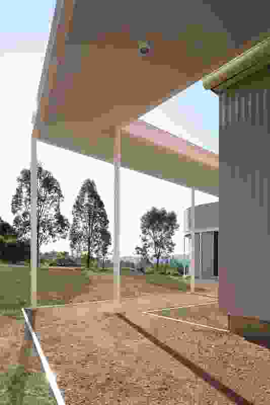 A covered walkway connects the three structures.