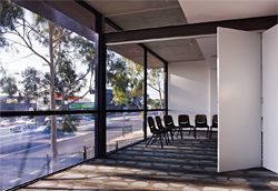 The lower level meeting room has a strong visual connection with busy Blackburn Road.