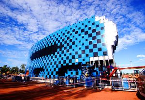 The pixelated facade represents a mirage in the flat landscape.
