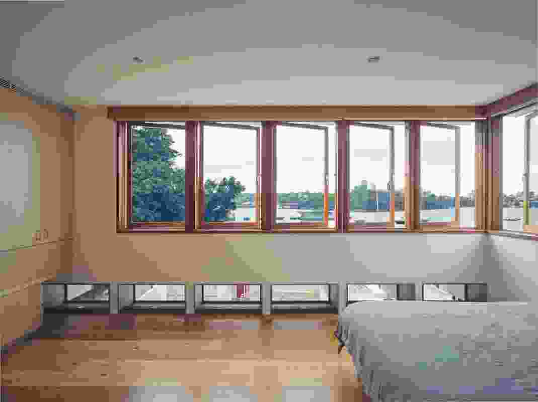 The strategic placement of windows in the main bedroom allows for extensive harbour views and climate control while maintaining privacy.