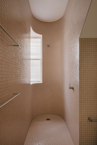 An existing reeded glass window was retained in the ground-floor shower.