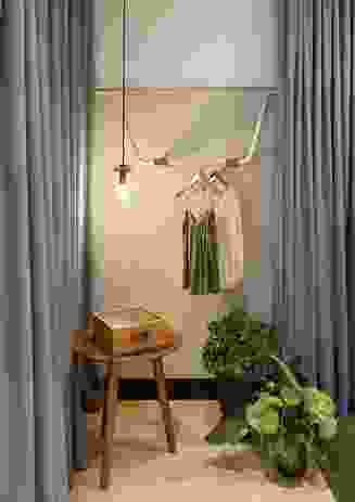 The dressing rooms feel intimate thanks to a combination of drapery, lighting, furniture elements and greenery.