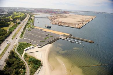 An aerial shot of the Port Botany expansion project, overlooking the boat ramp, pedestrian overpass and port terminal.