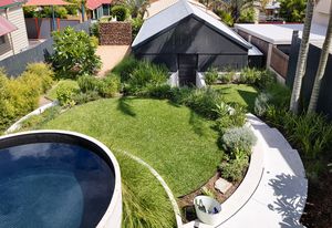 A plunge pool has been created from a concrete water tank craned onto the site and tiled in mosaics.