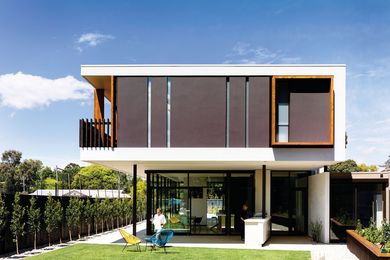 The upper floor appears to float above the weightless glass pavilion.