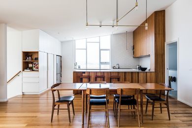 Blackwood veneer joinery and timber flooring and furniture accentuate the house’s white walls.