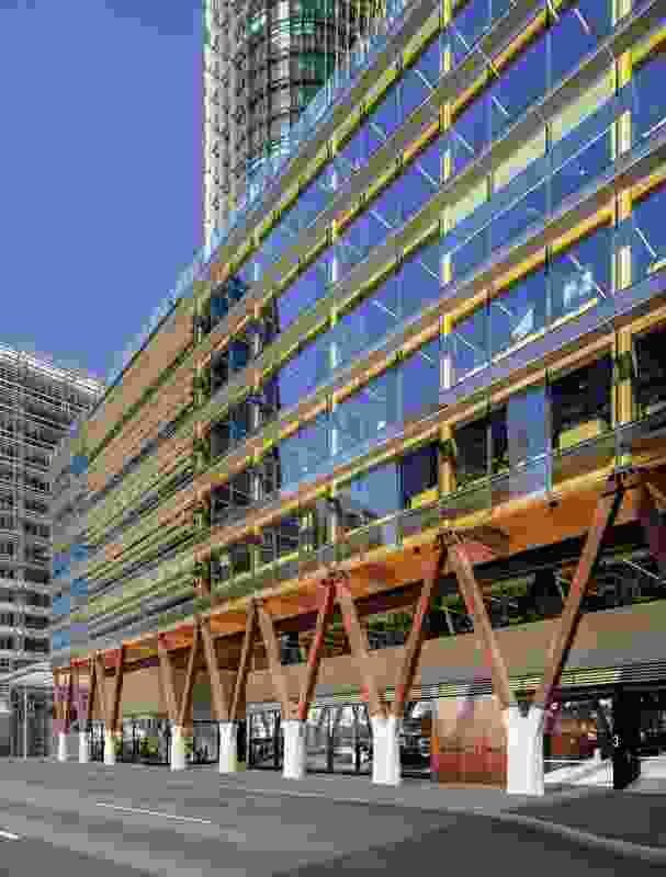 International House Sydney’s Sussex Street colonnade is held up by angled recycled ironbark props secured within in situ concrete bases.