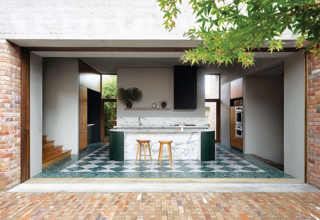 Wide openings draw the lush garden into the house. Photograph: Anson Smart.