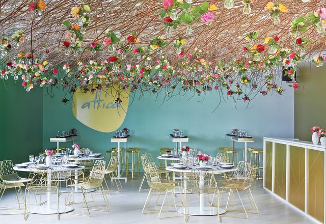 The attica pop-up restaurant on the second floor featured a stunning canopy of coppiced branches and roses in light bulbs, designed by Joost Bakker.