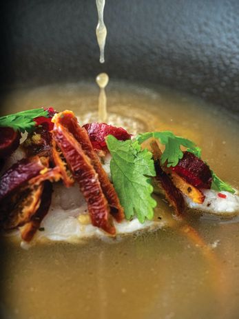 A dish of steamed bream, quandong and fish broth created by Jess Hodge.