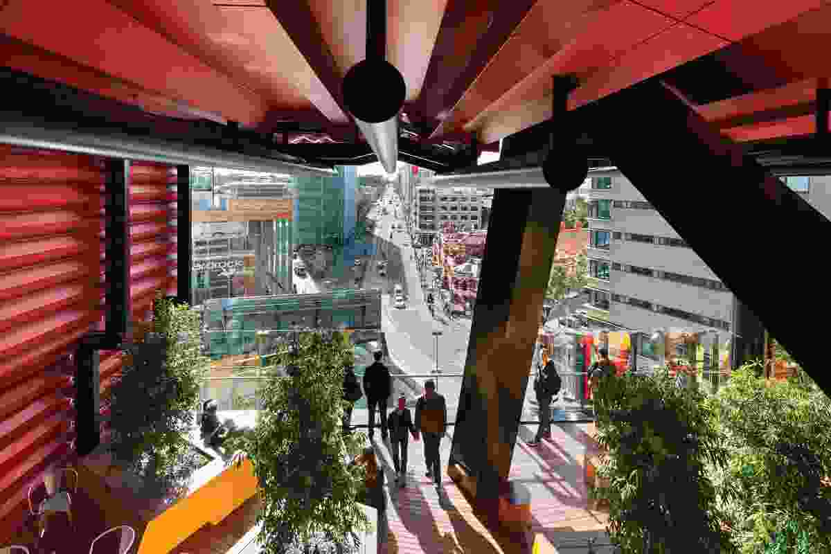 The view from a portal space towards the kink in Swanston Street, the Hardrock indoor rock-climbing centre, Design Hub and the “federation freestyle” of the Melbourne City Baths