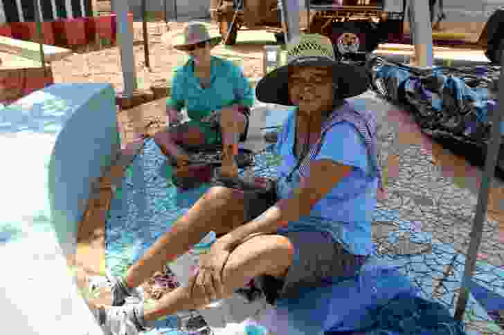 Terricita Corpos and Vanessa Margetts working on the mosaic at Liyan-ngan Nyirriwa.