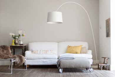 A Twiggy Lamp from Foscarini overhangs the sofa creating a cosy but casual living space.