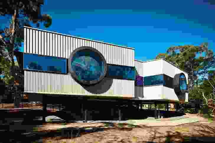 Two matching oculus windows look out from the laboratories, like binocular (or microscope) lenses: literally in search of birds, plant types and pond life.