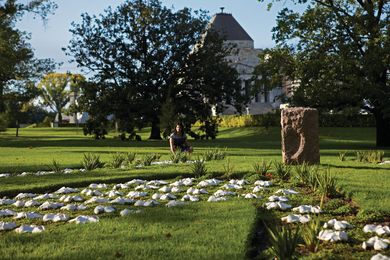 Katherine Rekaris in the garden she designed in memory of women who have served at war.