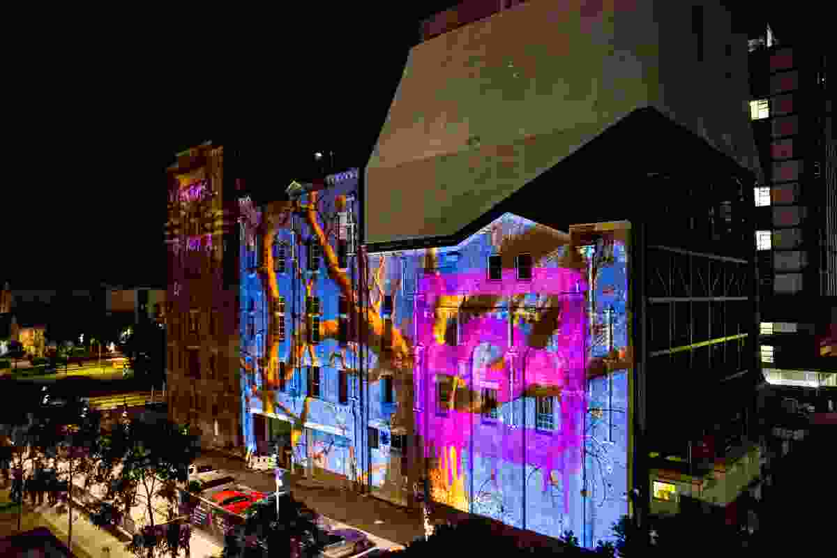 CULTURE IS NOT A LIFESTYLE CHOICE by Reko Rennie projected onto the Irving Street Brewery by Tzannes Architects.