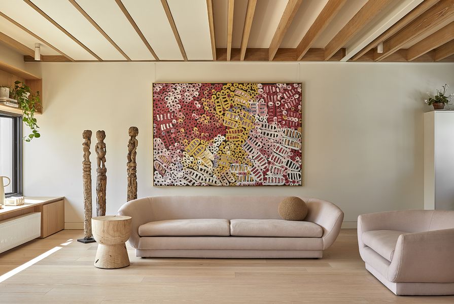 The living room blends Scandinavian and African style. Artwork: Minnie Pwerle.