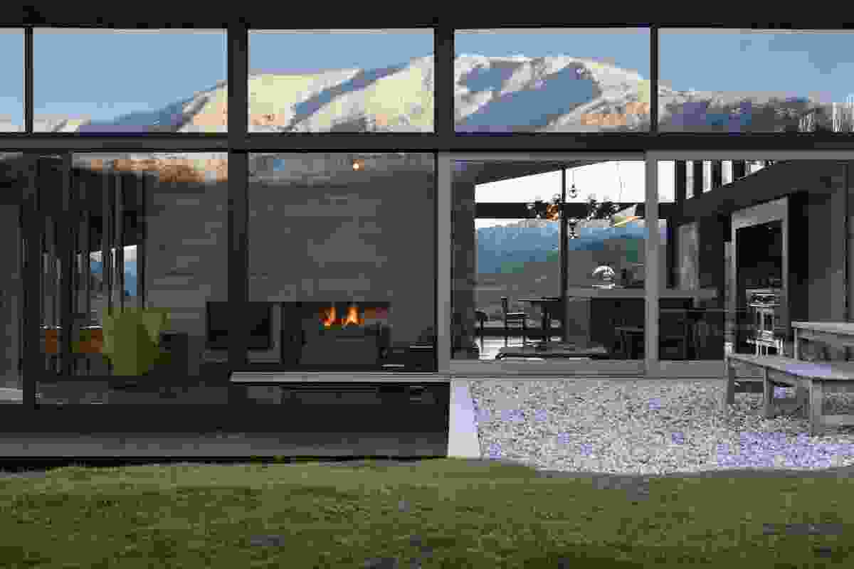 Expansive windows afford views over the alpine landscape.