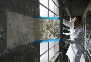 Jorge Otero-Pailos cleaning the wall of the Alumix factory in 2008.