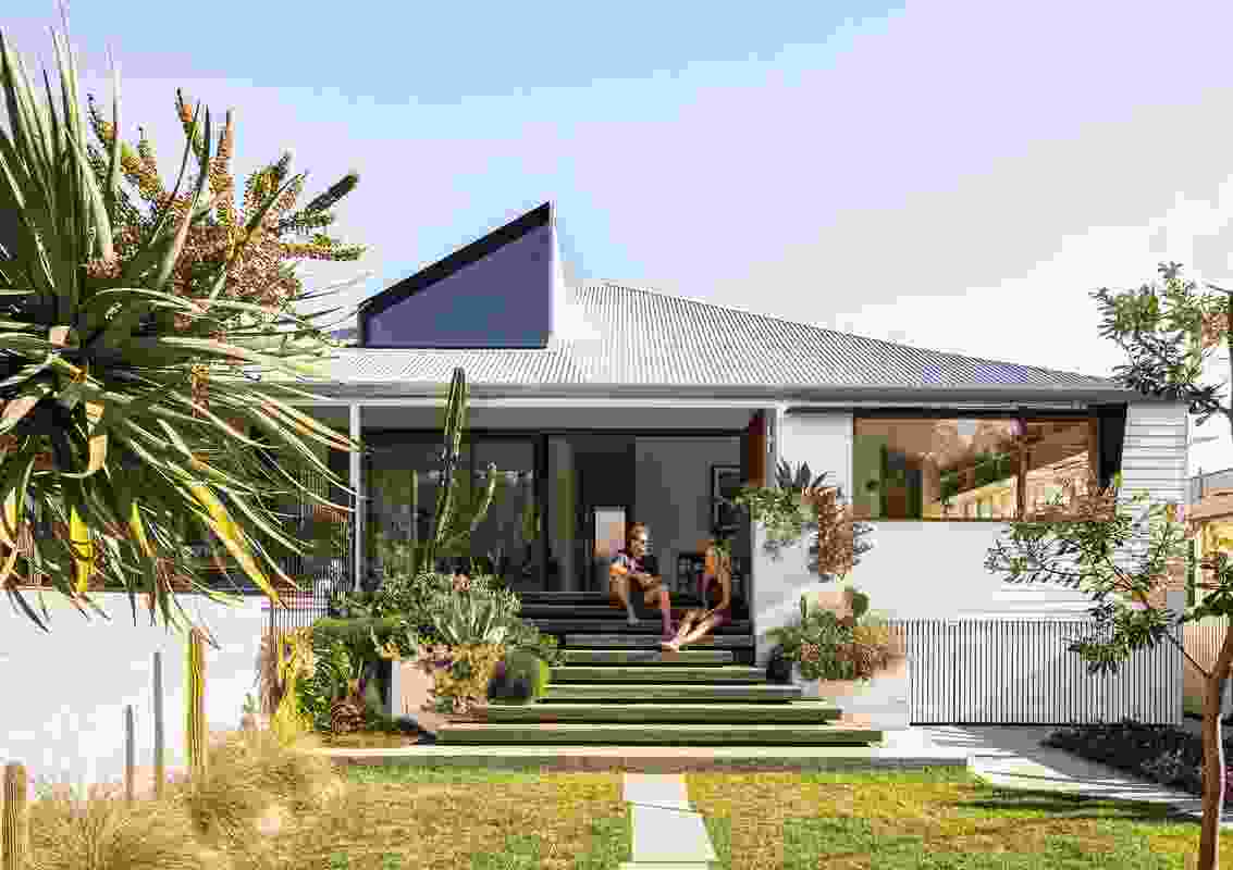 A wide verandah and stair provide a “vital” connection to the street and the broader community.