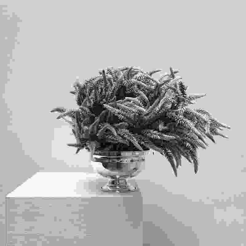 A silver bowl of feather-like grass was created to celebrate Maison Balzac’s Le Silence candle.