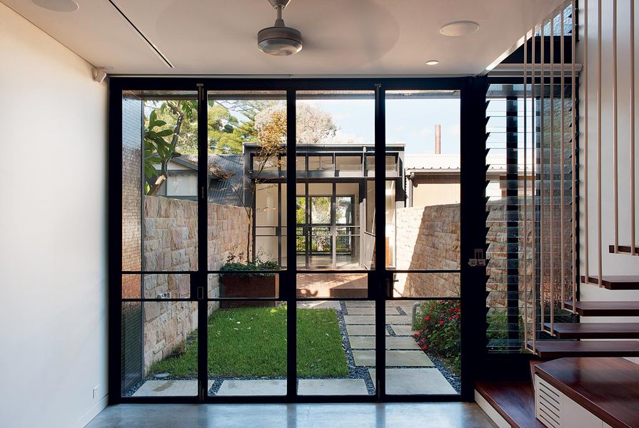 An enclosed courtyard separates the old and new sections of the house.