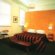 The Ballroom Suite, with the plywood wall of the bathroom box acting as furniture-like insert. Photo Pete Harmsen.